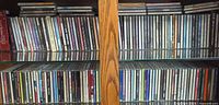 Full view of two rows of CDs on shelf
