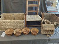Group shot showing chair, both large baskets, four small baskets, purse