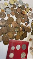 Overview of loose coins and red holder