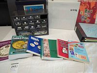 Overall lot with drawer cabinet, binders, Scott album and guides visible