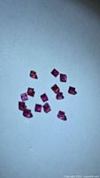 Group of square-cut rubies on white background
