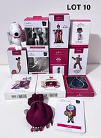 Group shot of all thirteen ornaments showing boxes and loose pieces