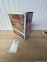 Slipcase showing Monopoly, Scrabble, Risk titles