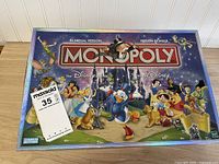 Closed box top showing Disney bilingual Monopoly artwork