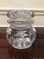 Front angled view of jar showing body shape and lid