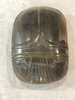 Top view of carved horn scarab paperweight