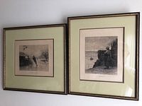Both framed etchings side-by-side on wall