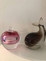 Both paperweights side by side showing overall size and forms