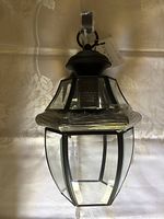 Front view of lantern with tag and wrapping visible