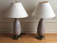 Both matching art glass table lamps with shades, cords visible