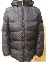 Front view of black Via Spiga down puffer coat with hood
