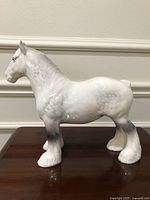 Left side profile of Beswick Shire Horse figurine on tabletop