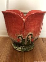 Front view of red poppy-shaped Intrada planter