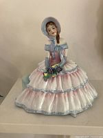 Front view of Royal Doulton Daydreams figurine showing full dress and bouquet