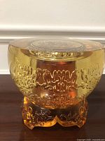 Front view of amber liuli treasure bowl on ornate base