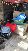 Overall lot showing deck box with multiple totes stacked on top
