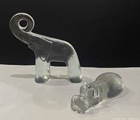 Front view of clear glass elephant and hippo figurines