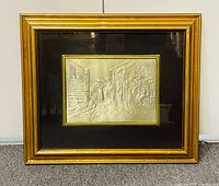 Front view of framed sterling silver relief