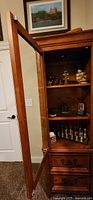 Full cabinet with door open showing shelves and drawers