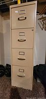 Full front view of beige 4-drawer metal file cabinet