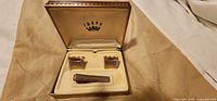 Open Swank box showing tie bar and cufflinks