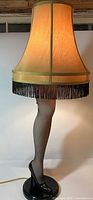 Front view of leg lamp showing shade, leg, and base