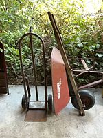 Hand truck and wheelbarrow side by side