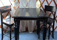 Table and two chairs front view