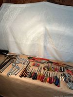 Overall view of all hand tools laid out on table