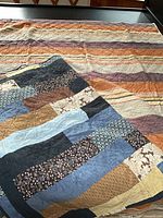 Both quilts laid out showing primary patterns