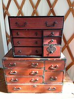 Front view of both Tansu chests stacked, showing overall design and drawer arrangement