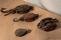 Group shot of four pulleys on tabletop