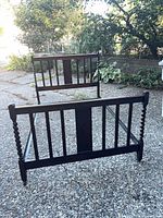 Headboard, footboard and side rails assembled outdoors showing overall form
