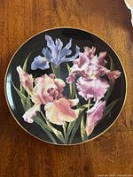 Front view showing iris design and gold rim