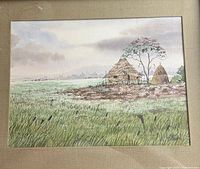 Front view of framed watercolor landscape showing hut, grasses and overall composition