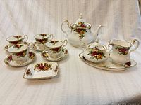 Full teaset layout showing all 13 pieces