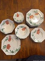 Stacks of plates and bowls showing overall quantity and pattern
