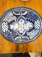 Top view showing full blue and white Talavera design and oval shape
