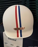 Front view of helmet showing color, stripe and badge