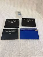 Outer cardboard sleeves labeled 1980, 1981, 1982, 1983