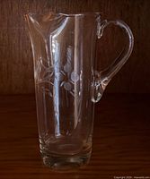full front view of clear etched glass pitcher