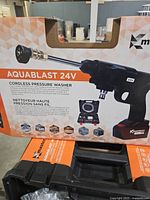 Retail box front showing Aquablast 24V cordless pressure washer details