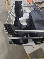 Metal wire holder containing folded black bags