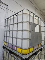 IBC tote overall view showing metal cage and pallet base