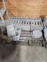 Top view of pallet with assorted concrete blocks and round pad