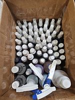 Top view of box filled with sample-size spray bottles