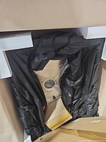 Packaged stainless steel sink inside box with protective wrapping