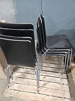 Side view of stacked chairs on pallet