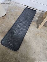 Full view of rubber boot mat on floor