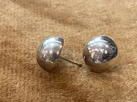 Pair of polished sterling silver dome stud earrings with posts